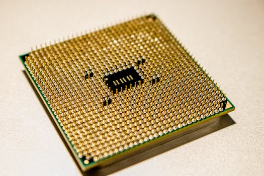 Detailed close-up of a golden microprocessor chip, ideal for technology concepts.